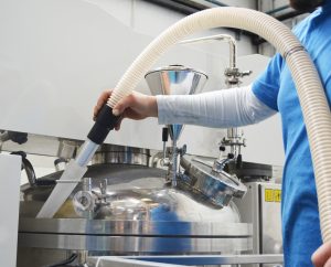 Vacuuming on pharmaceutical machinery with silicone accessory